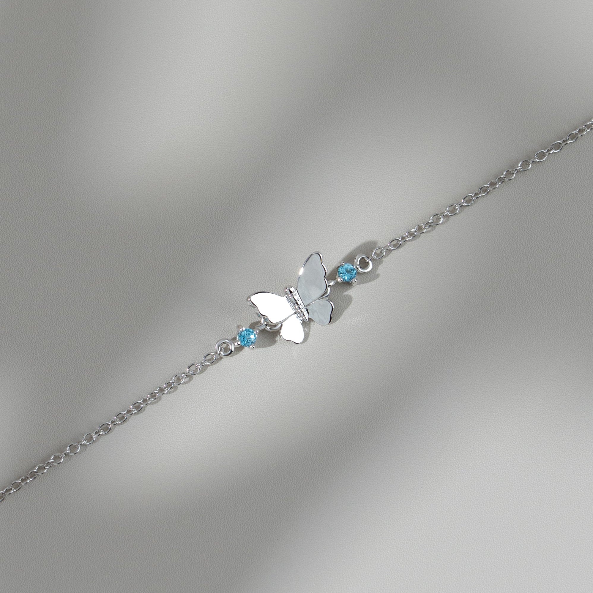 Classic Round Blue Topaz Butterfly Bracelet in 9ct White Gold